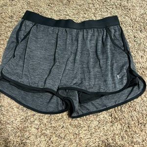 Black and dark grey track shorts with spandex insert